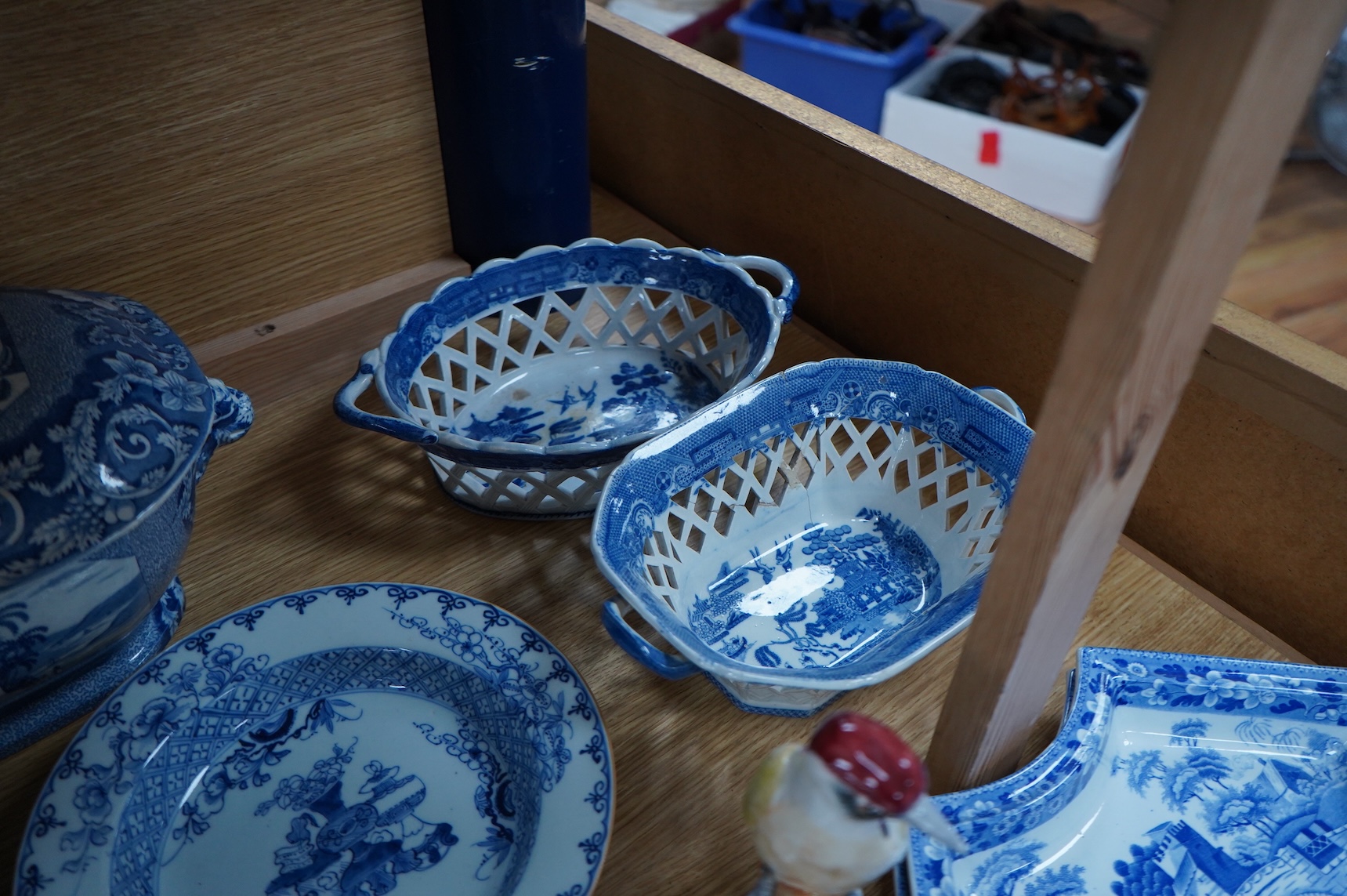A group of Victorian blue-printed dinner wares, including a Chinese blue and white dish and a Wade bird (13).